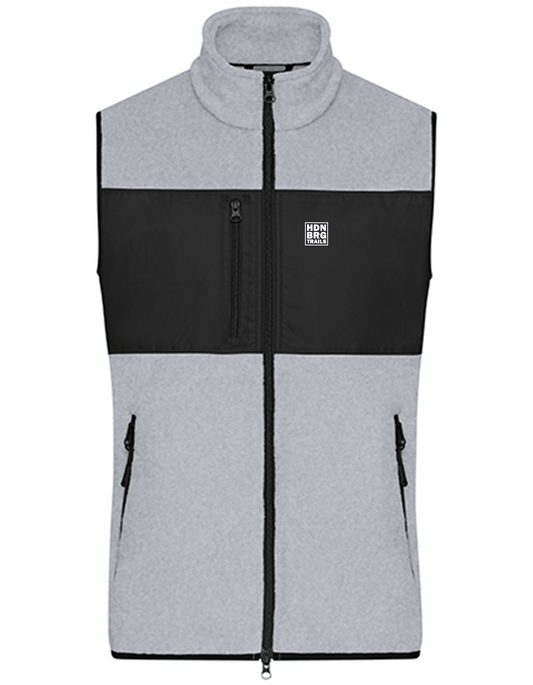 A lightgrey Vest with a embroided "HDNBRG Trails" Emblem on the left Chest.
