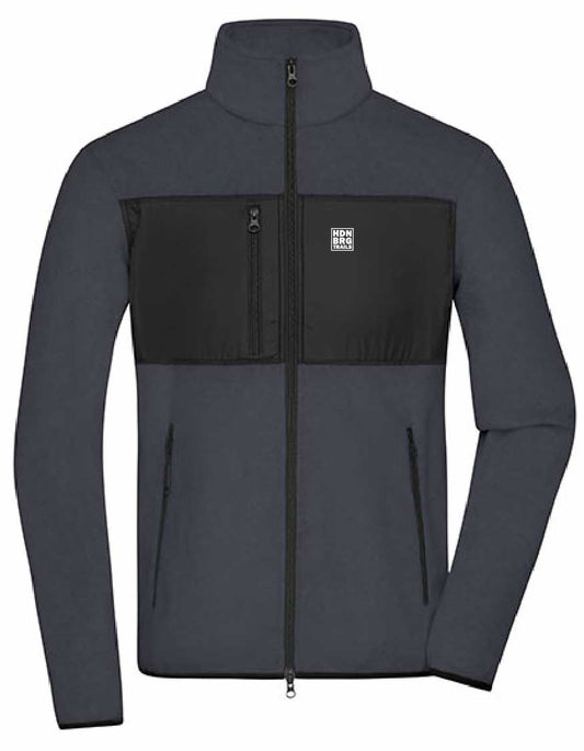 A darkgrey Jacket with a embroided "HDNBRG Trails" Emblem on the left Chest.